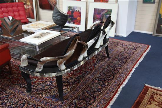 Anthony Redmile. An unusual cow horn and hide three seat settee, W.5ft 8in.